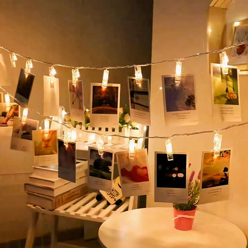 Photo Clip Fairy Lights hung with pictures on a wall